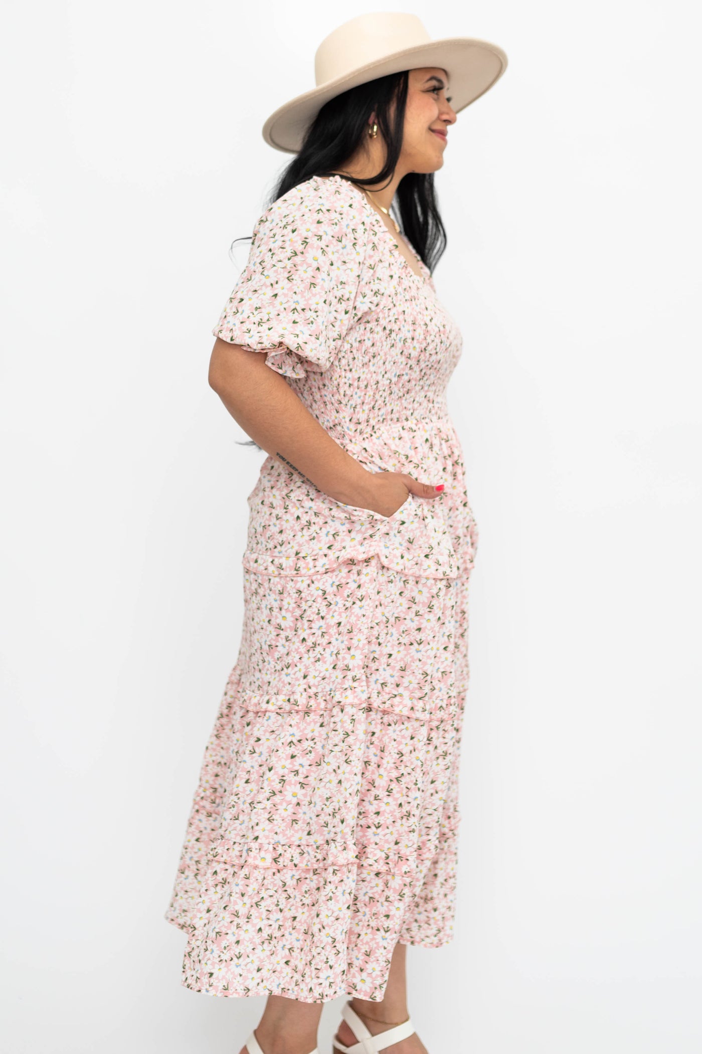 Side view of a pink flower dress with short sleeves