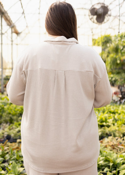 Back view of a taupe top