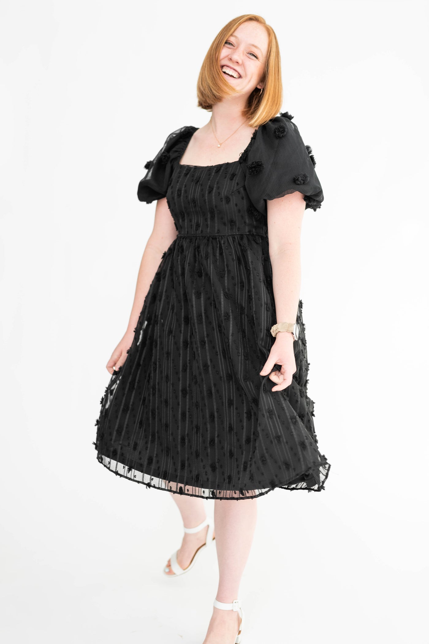 Medium black dress with short sleeves and square neck