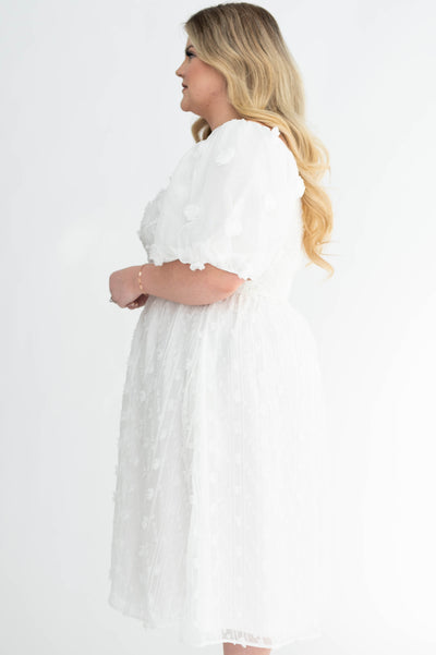 Side view of a 2x plus size white dress
