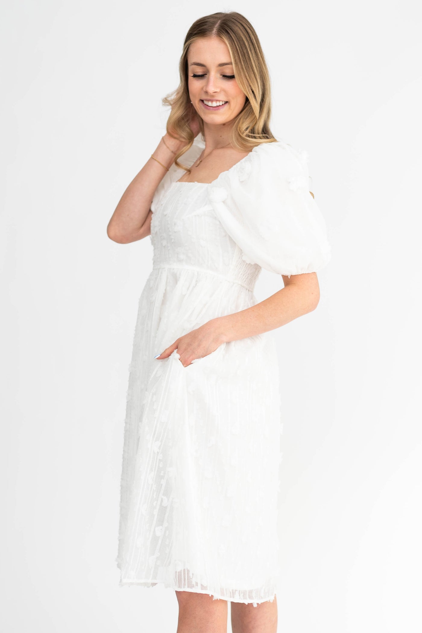 Side view of a short sleeve white dress