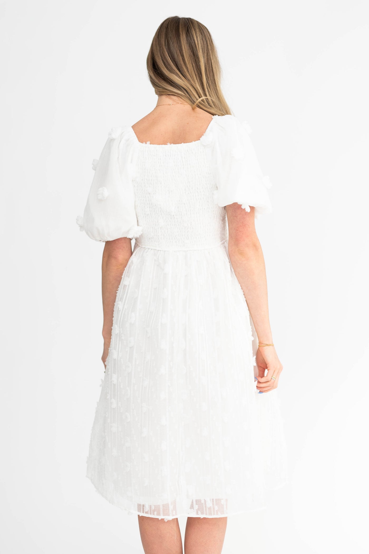 Back view of a short sleeve white dress