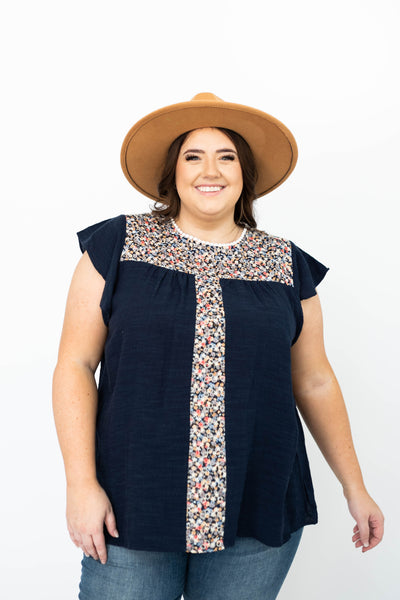 Front view of a plus size ivory top