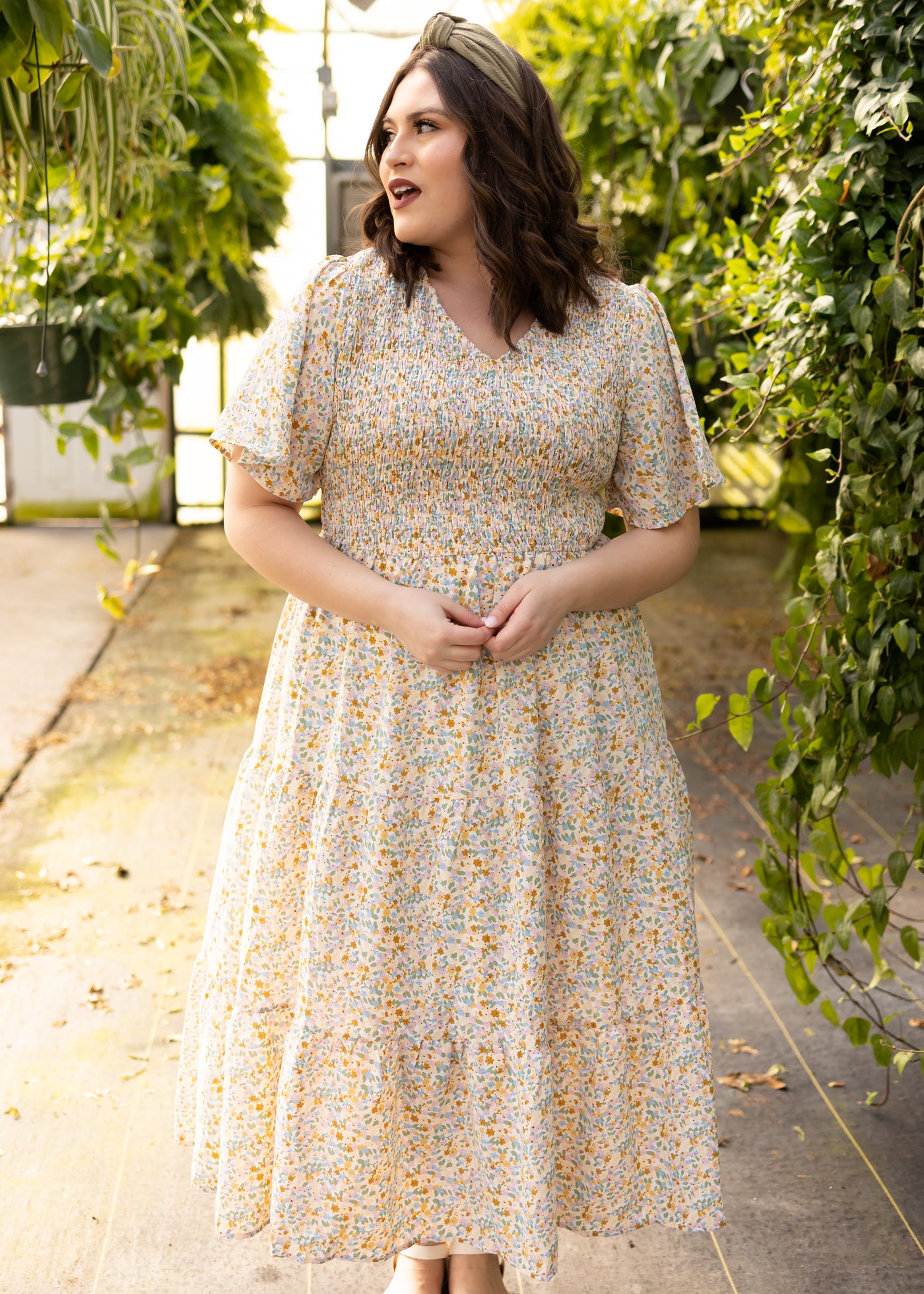 Short sleeve plus size floral dress with v-neck and smocked bodice