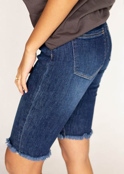 Side view of indigo bermuda shorts