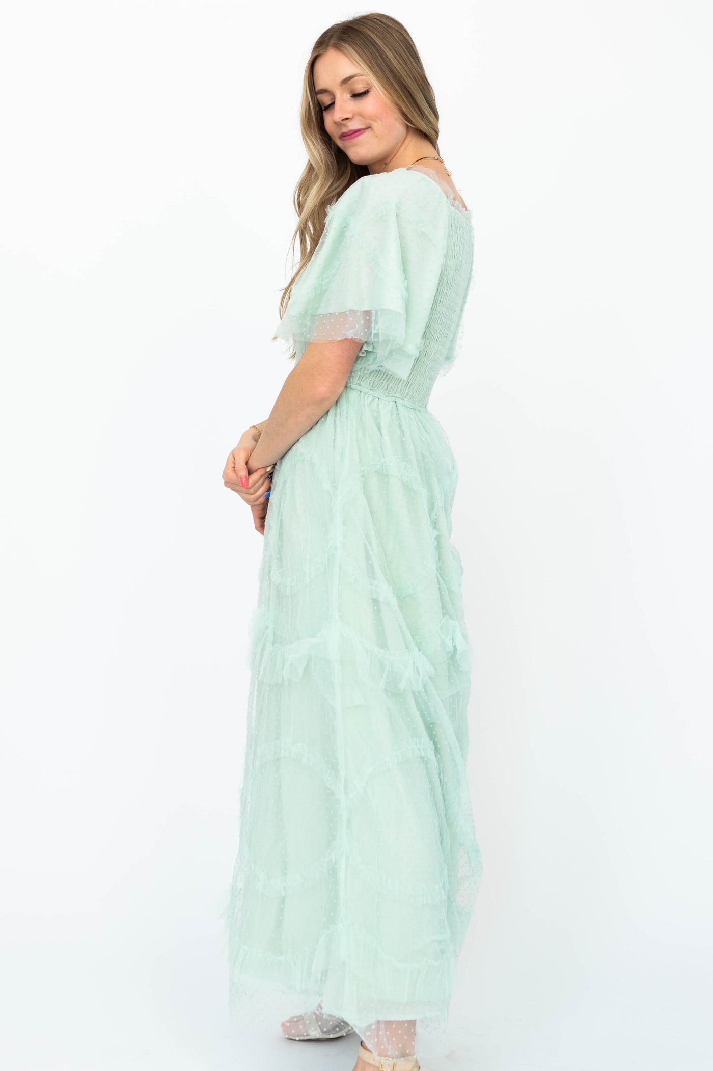 Side view of a mint dress with short sleeves