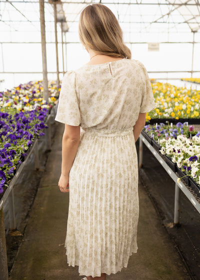 Back view of a sage floral dress