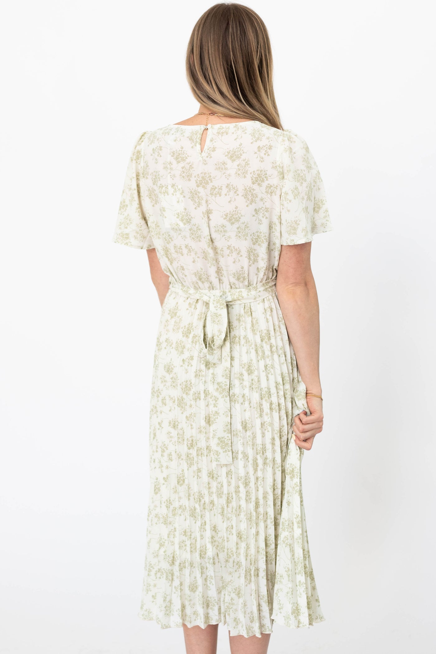 Back view of a sage floral dress