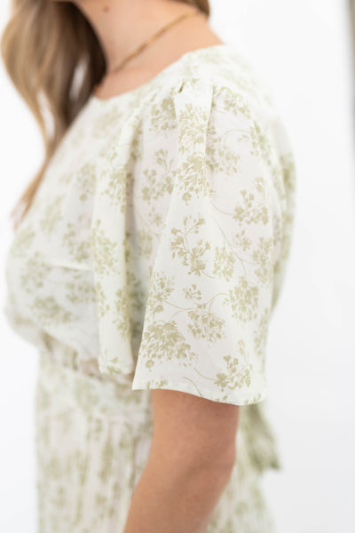 Sleeve of a sage floral dress