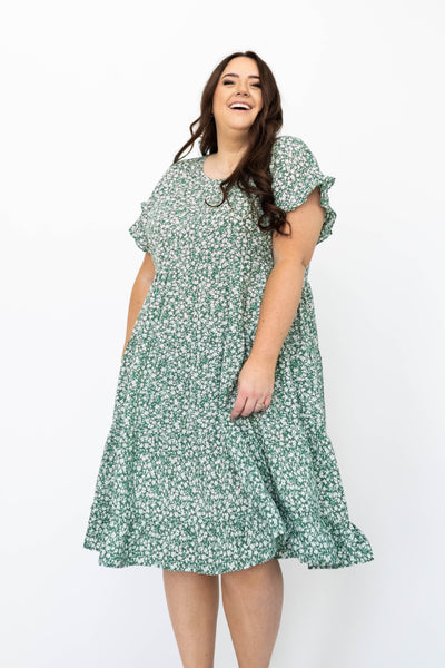 Cap sleeve plus size green floral dress with tiered skirt