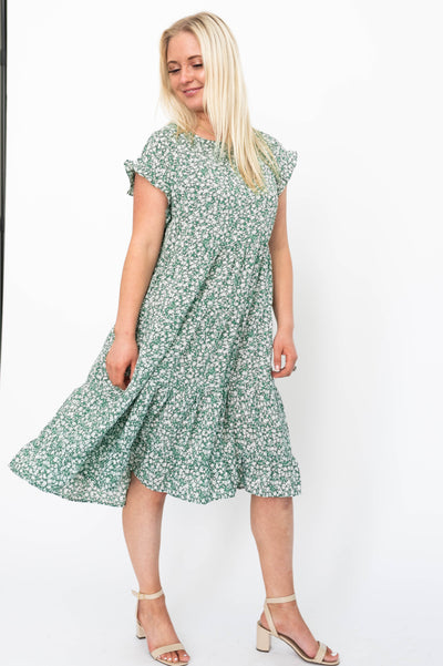 High waisted green floral dress with ruffle at the cuff