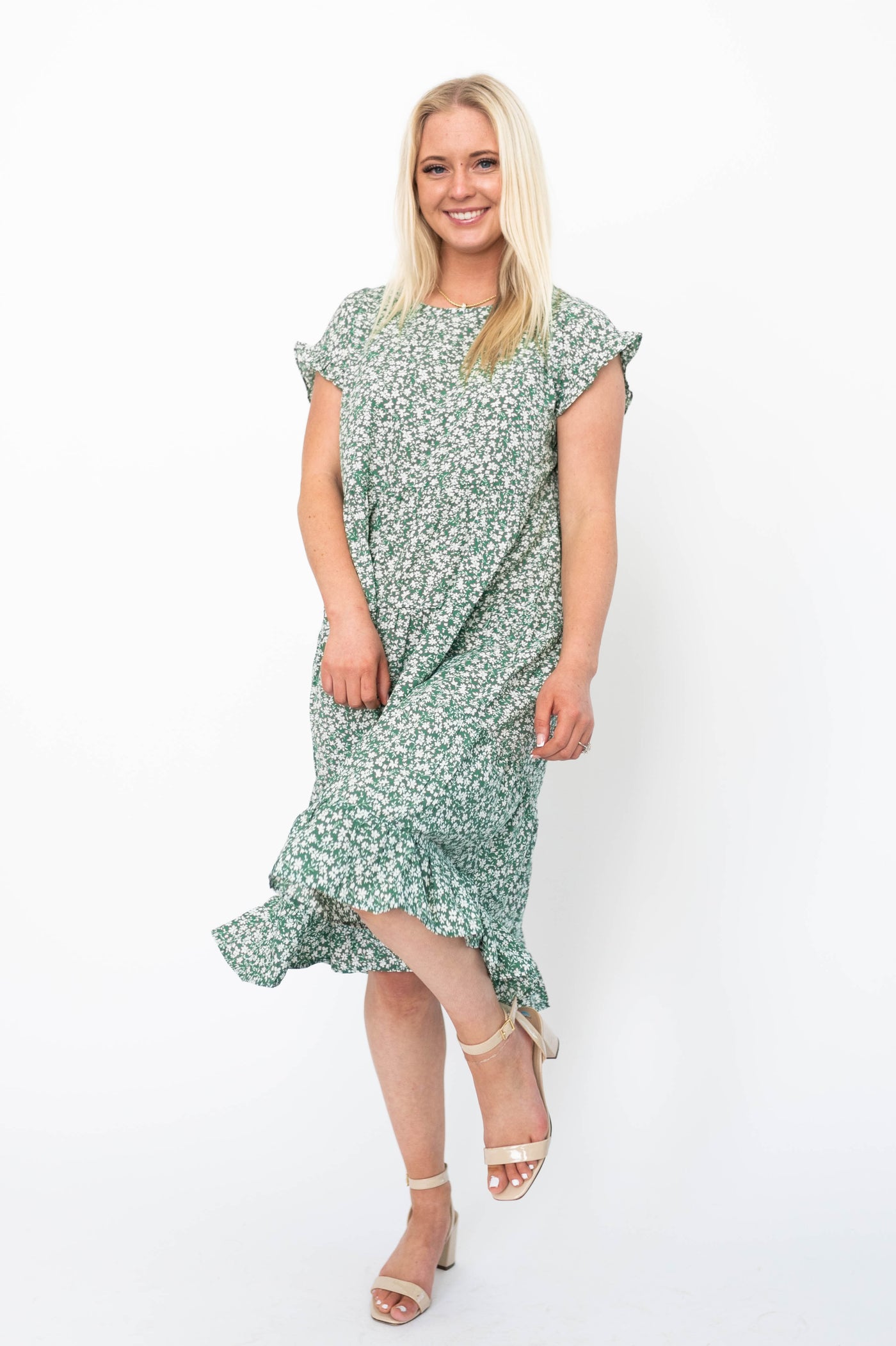 Short sleeve green floral dress with ruffle at the hem