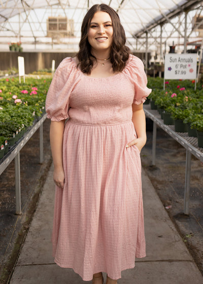 Short sleeve dusty pink dress with smocked bodice and pockets