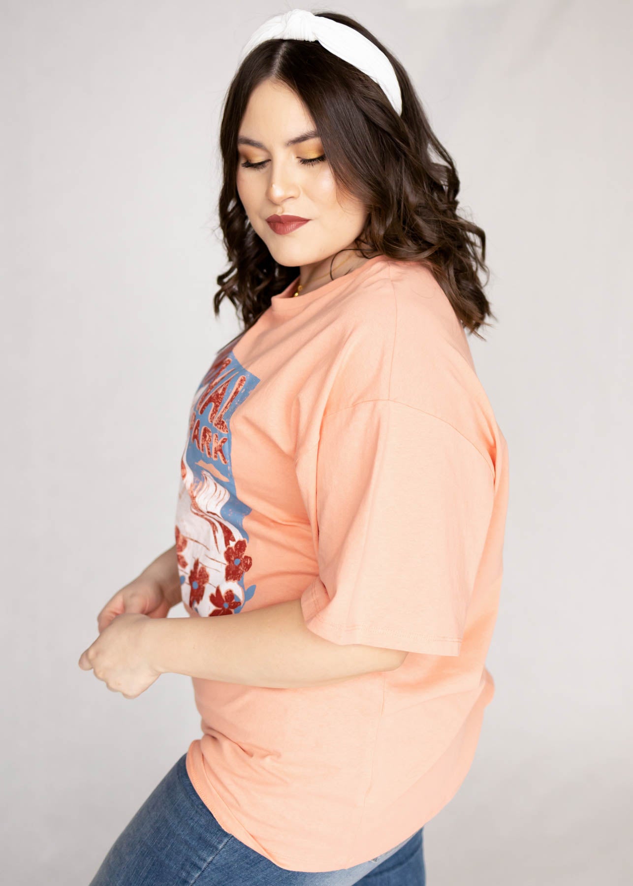 Side view of a short sleeve salmon top