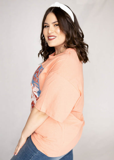 Side view of a plus size salmon top