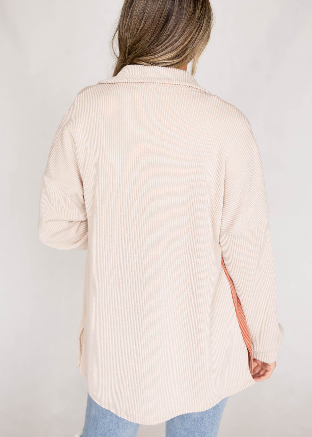 Back view of a cream shacket