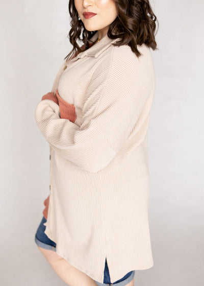 Side view of a plus size cream shacket