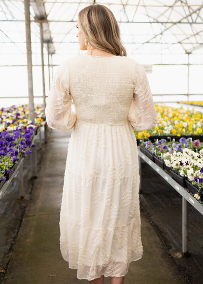 Back view of a cream dress