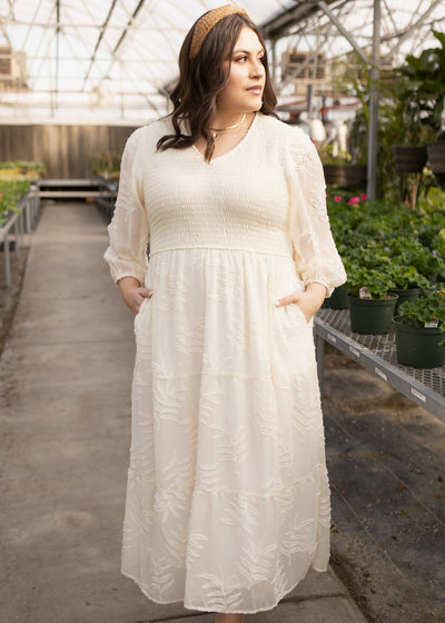 Plus size cream dress with a v-neck