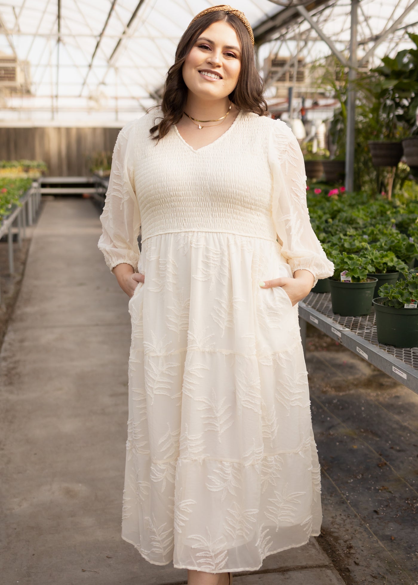 Plus size cream dress with smocked bodice, pockets and 3/4 sheer sleeves