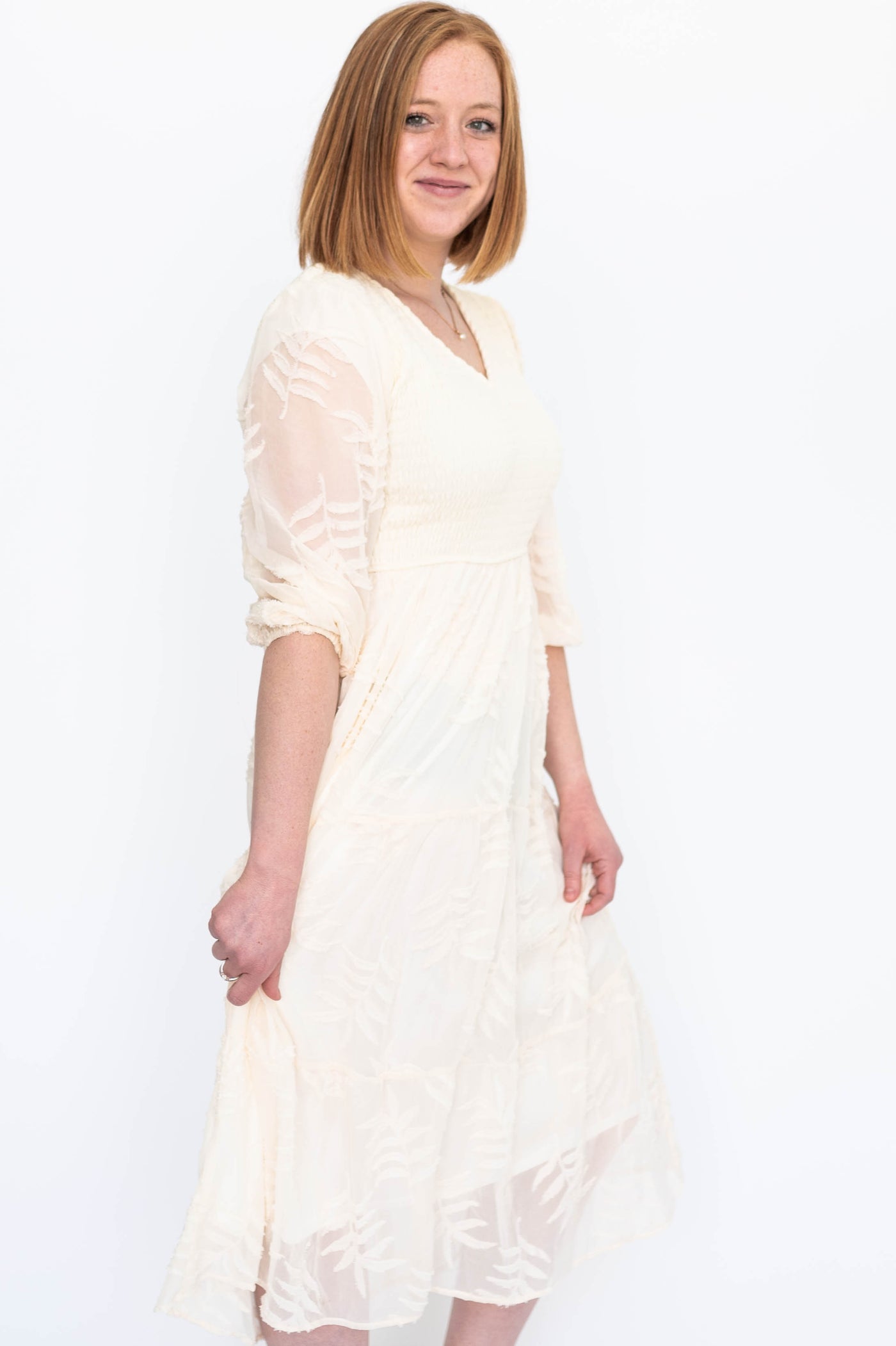Side view of a cream dress