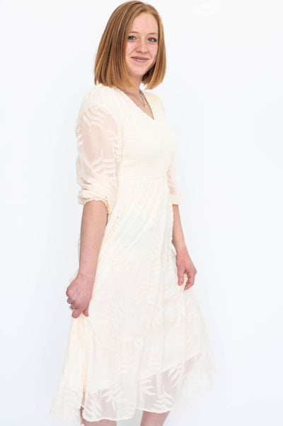 Side view of a cream dress