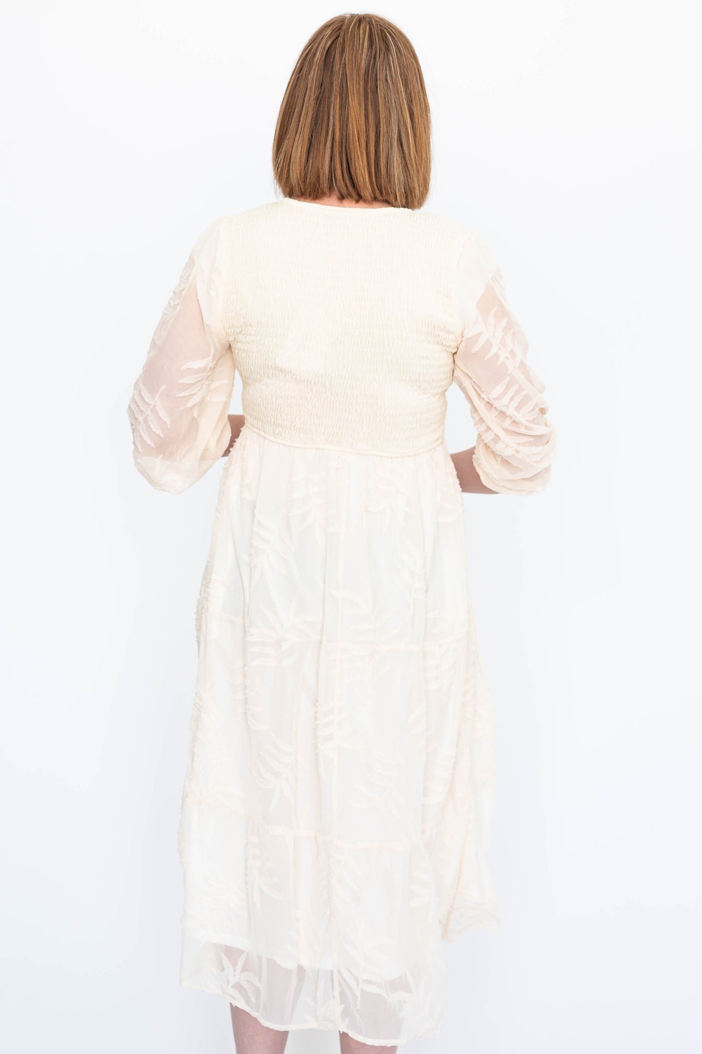 Back view of a cream dress