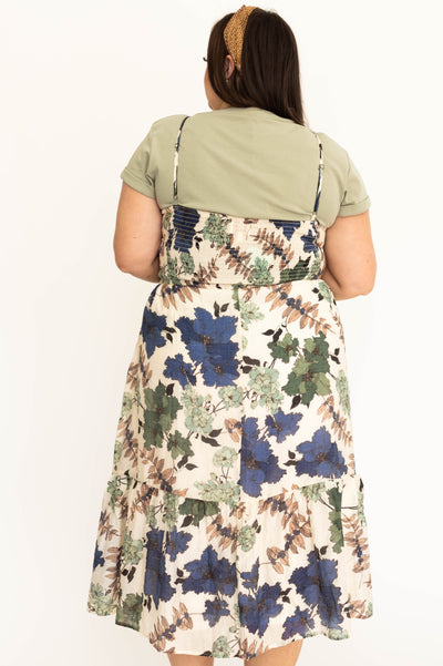 Back view of a plus size cream floral dress