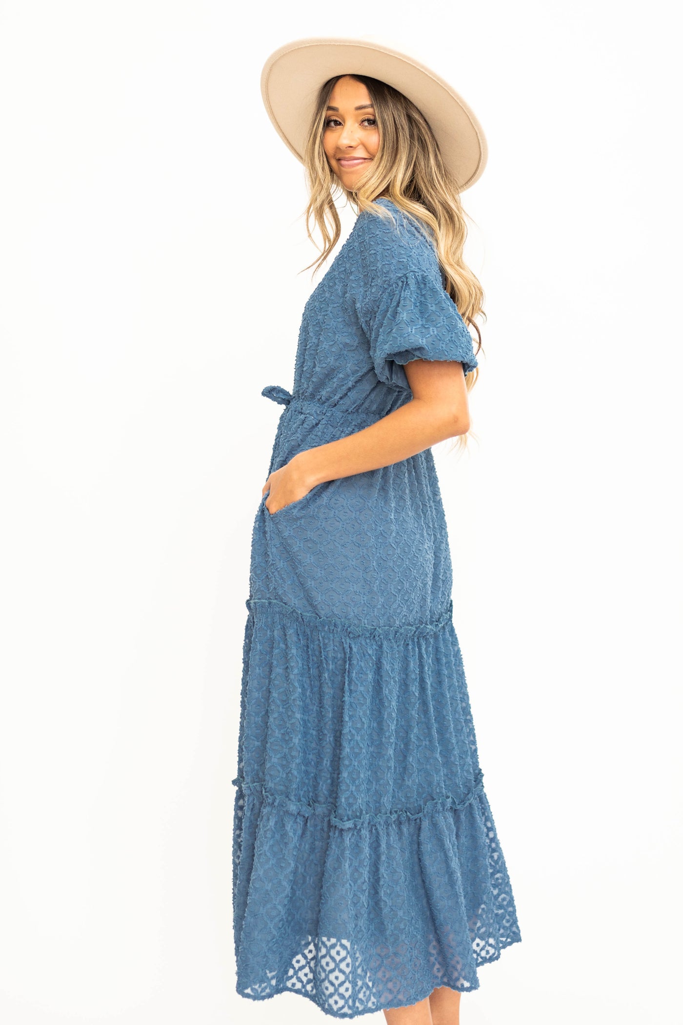 Side view of a short sleeve denim blue dress