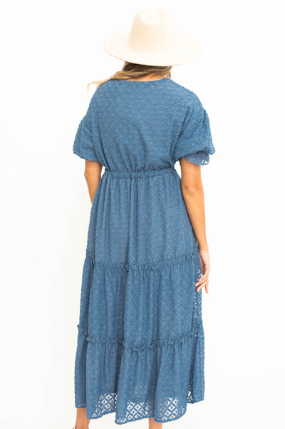 Back view of a denim blue dress