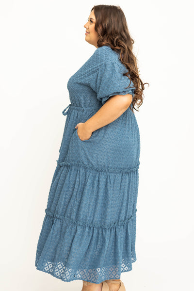 Side view of plus size denim blue dress
