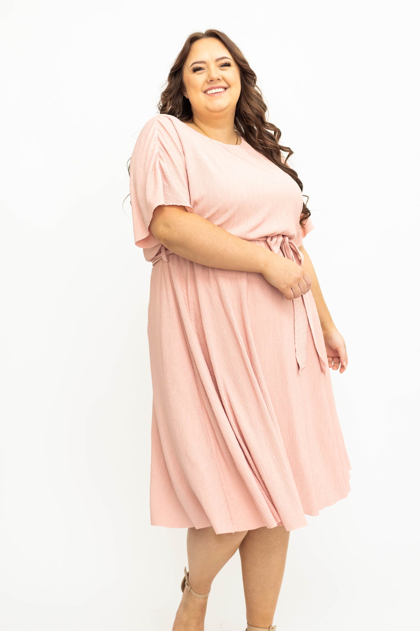 Plus size pink dress that ties at the waist