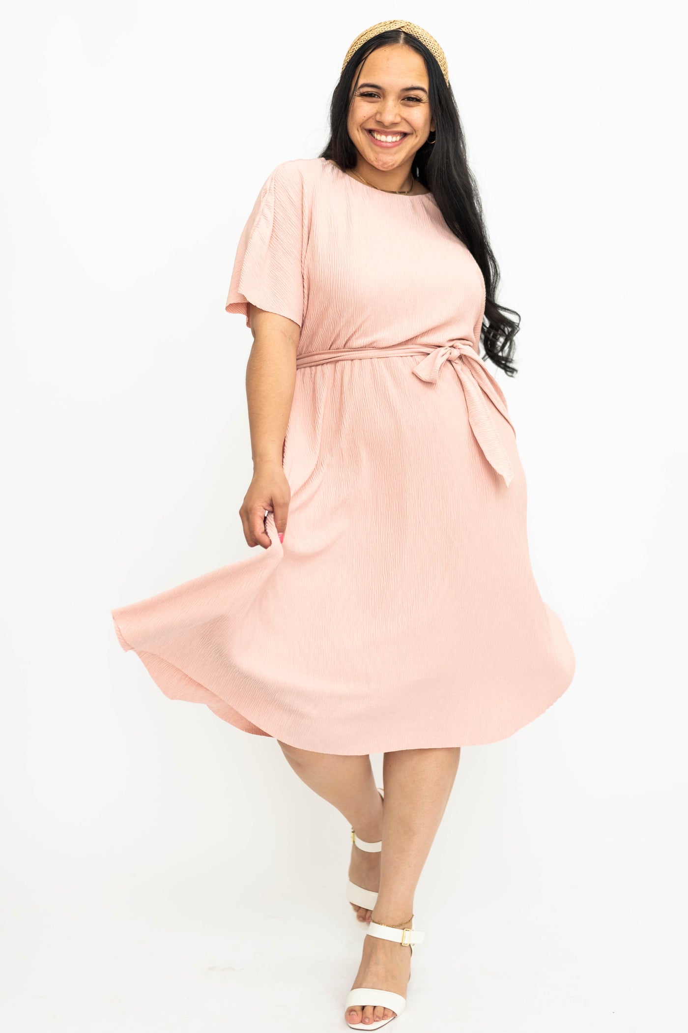 Large knee length pink dress with short sleeves
