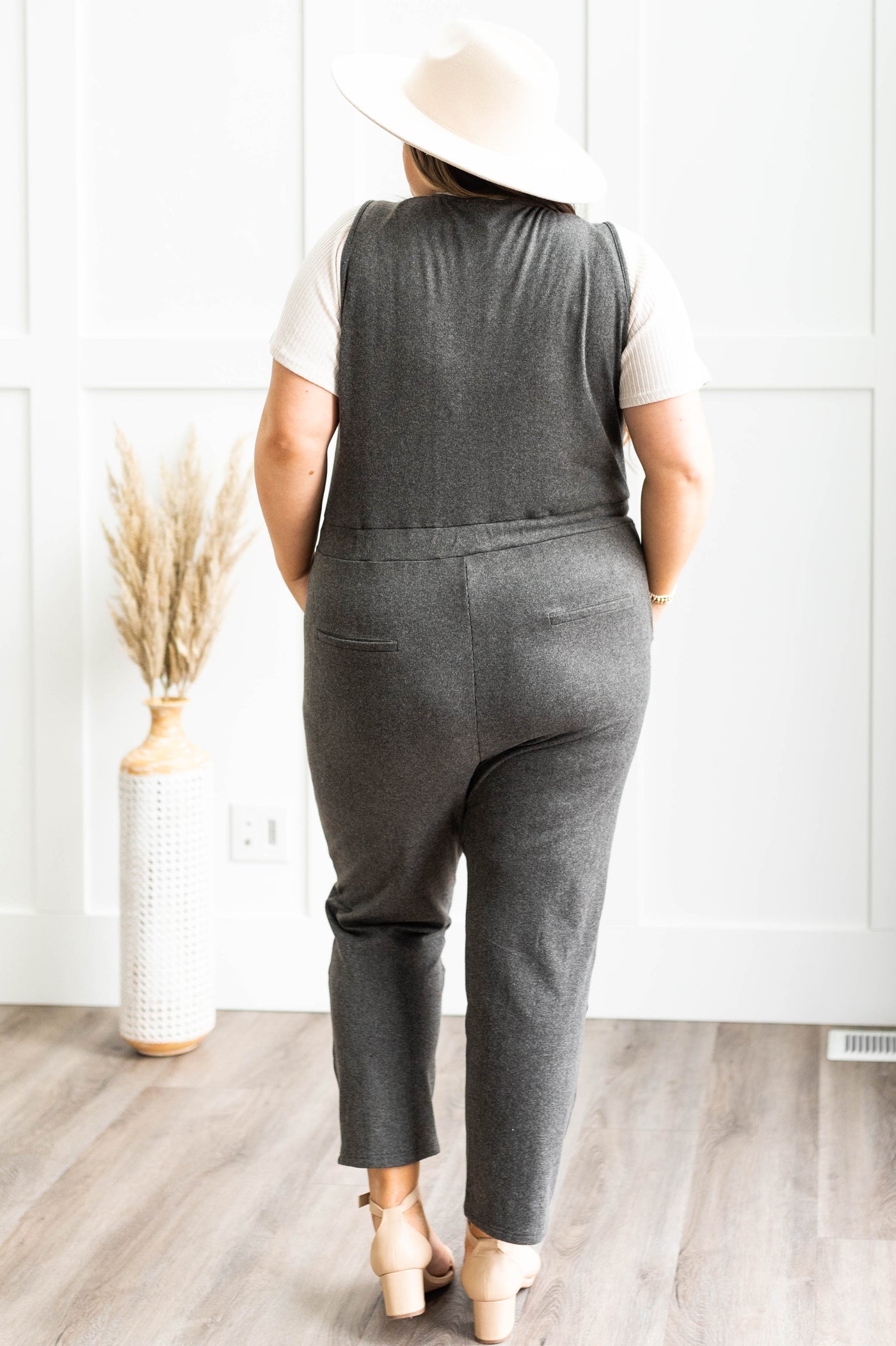 Back view of a plus size charcoal jumpsuit