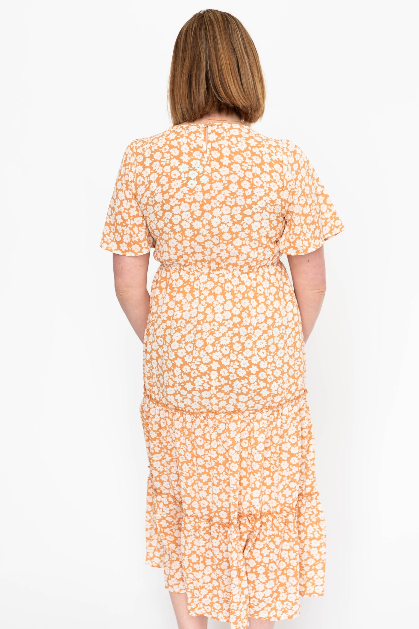 Back view of a apricot dress