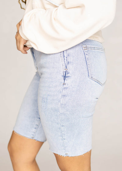 Side view of light wash shorts