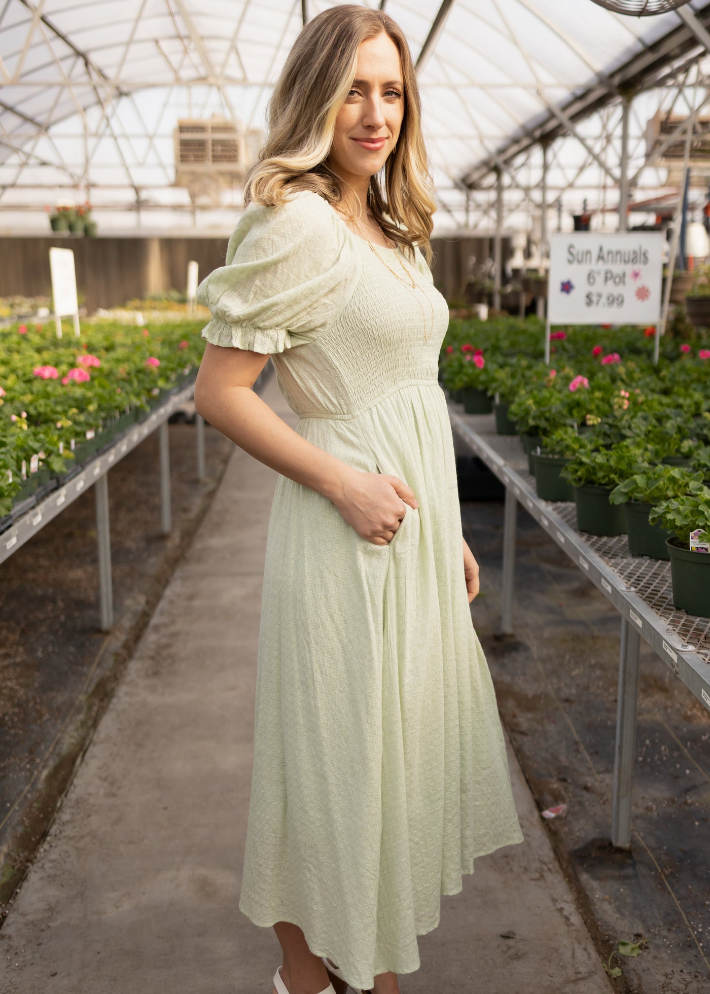 Side view of a short sleeve sage dress