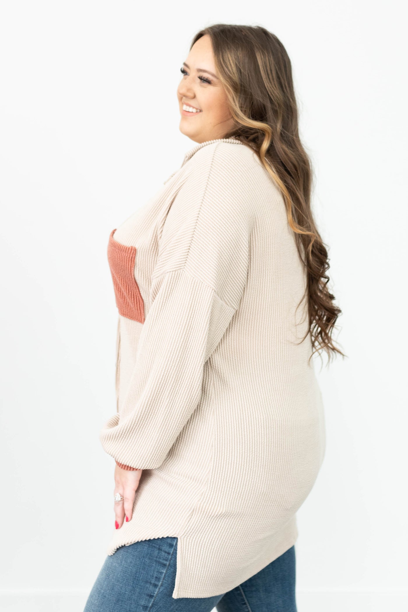 Side view of a plus size taupe rubbed shacket