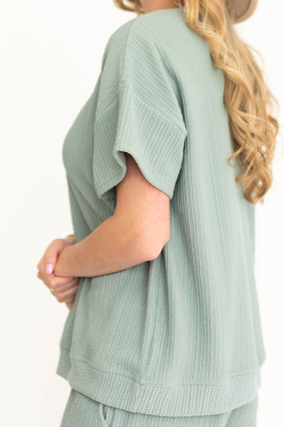Side view of a dusty sage top
