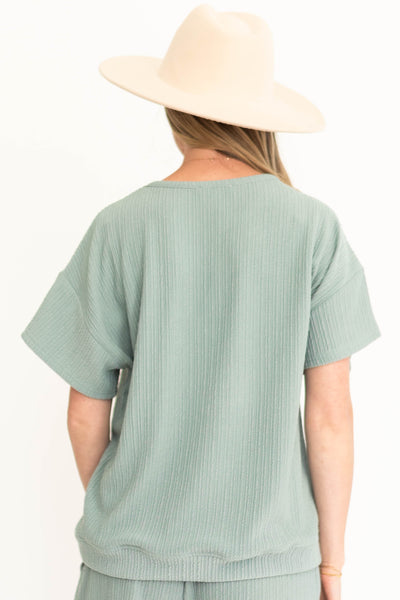 Back view of a dusty sage top