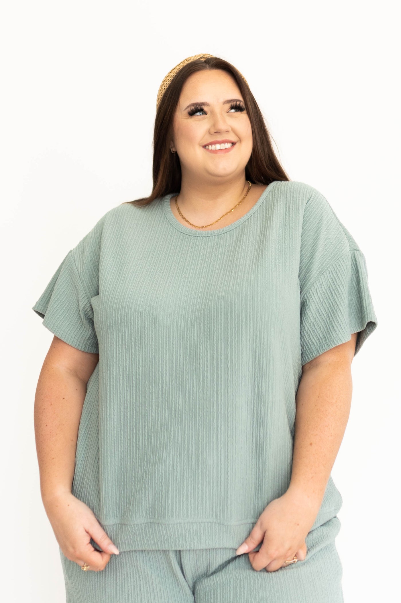 Plus size front view of a short sleeve dusty sage top