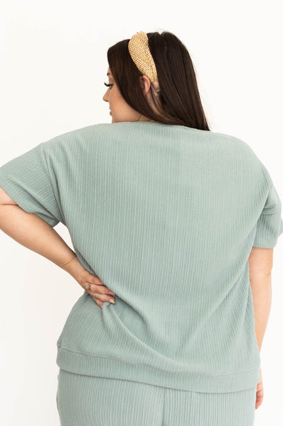 Back view of a dusty sage short sleeve top