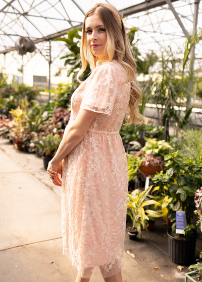 Side view of a peach floral dress
