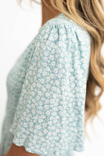 Sleeve of a sage floral dress