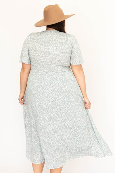 Back view of a plus size sage floral dress
