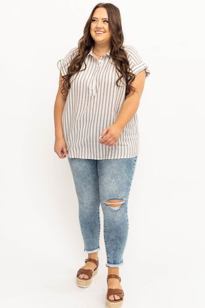 Plus size medium wash jeans with distressing