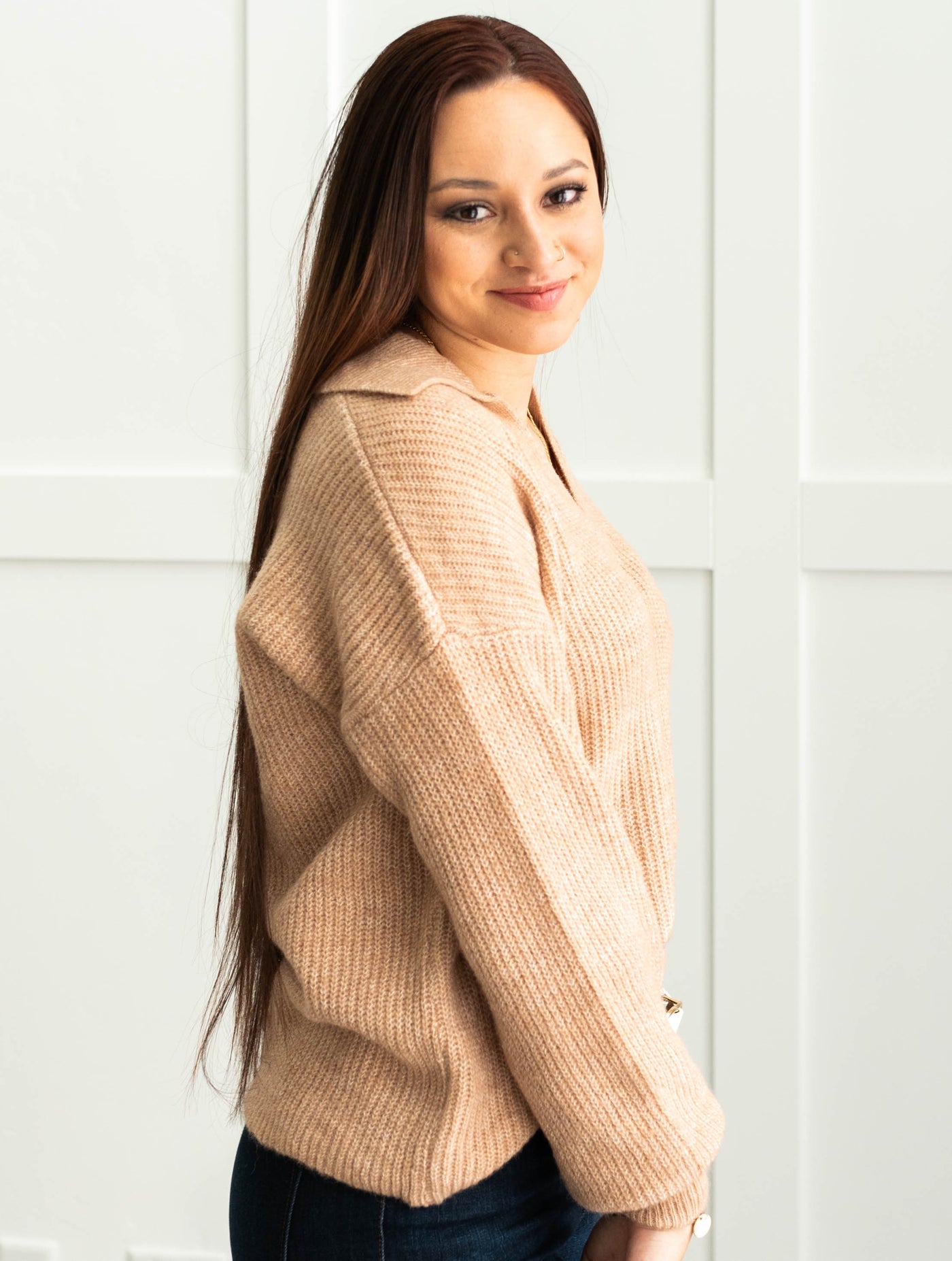 Side view of a camel sweater