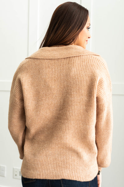 Back view of a camel sweater