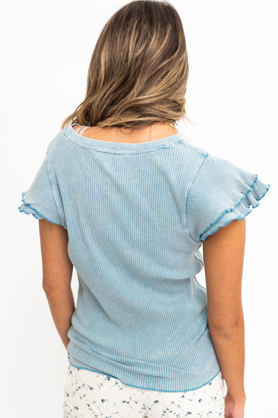 Back view of a knit denim top