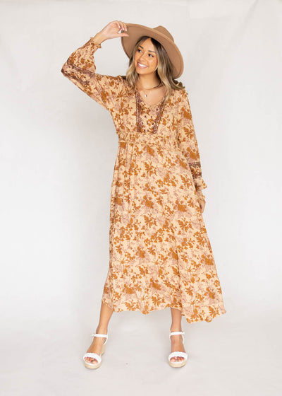 Camel dress with floral print and stitch detail at the neck and sleeves
